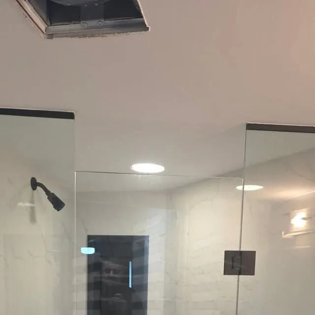 Frameless shower corner with clear glass